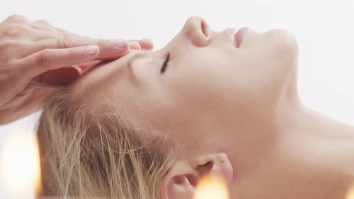 Woman is Getting Massage Treatment From the Therapist Massaging Procedure in Spa Healthcare