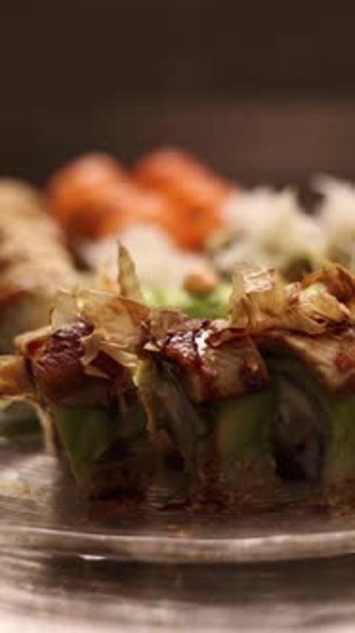 a set of sushi on a silver background, overhead view
