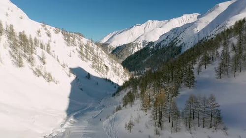 Scenic Aerial View of Ski Slope in Snowy Mountains