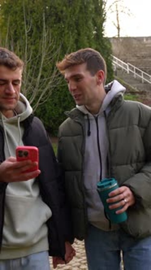 Happy gay couple sharing a moment in the park