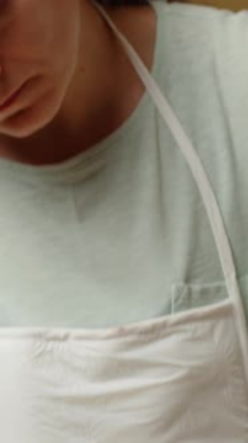 Vertical video. Whisking a Thick Batter in a Glass Bowl, Preparing the Dough for Further Steps.