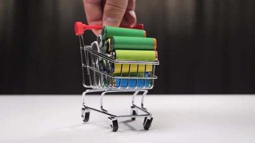 Mini Shopping Cart Filled with Batteries Close Up