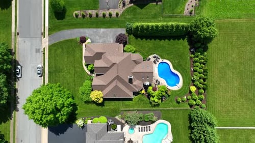 Done top down over luxury villas with Swimming pool in idyllic neighborhood of USA. Large real estat