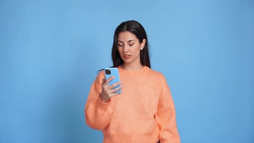 Woman Reacting to Something on Her Phone
