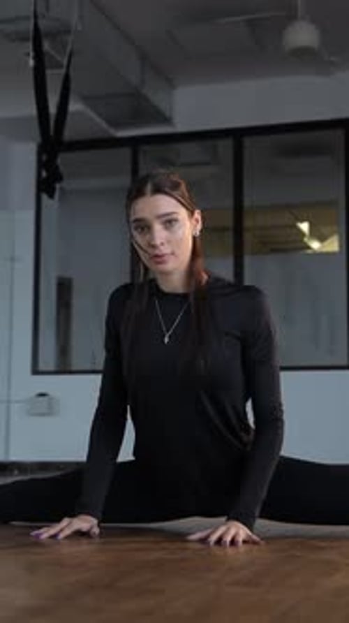 Woman Doing Splits in Fitness Studio