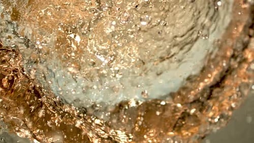 Juicy freshness explosion. Healthy natural juice splashing in extreme slow-motion. Dramatic close-up