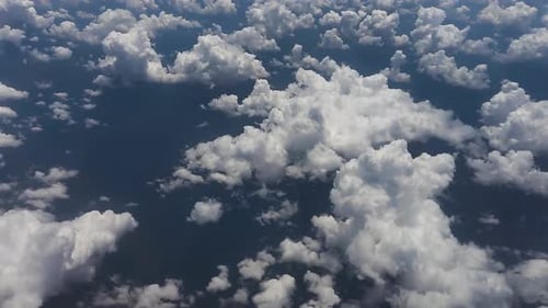 view of airplane cabin, white clouds
