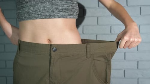 Lady Success Loosing Weight on Belly Indoor