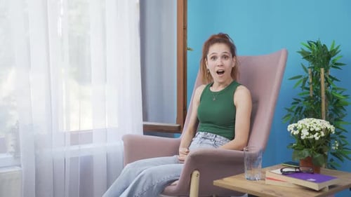 Woman Reacts with Surprise and Claps Her Hands