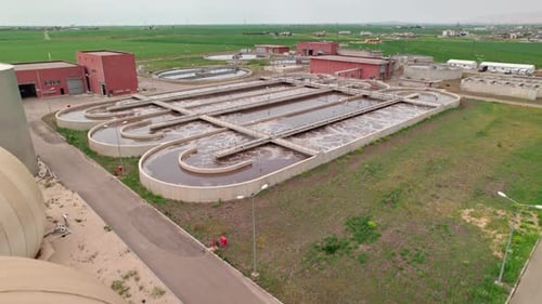 Aerial Drone View of Modern Water Treatment Plant in Green Valley, Clean Environment Concept