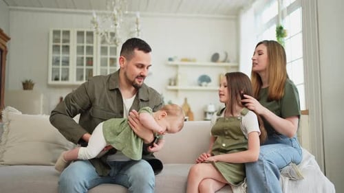 Loving Family Relaxing Together on Couch