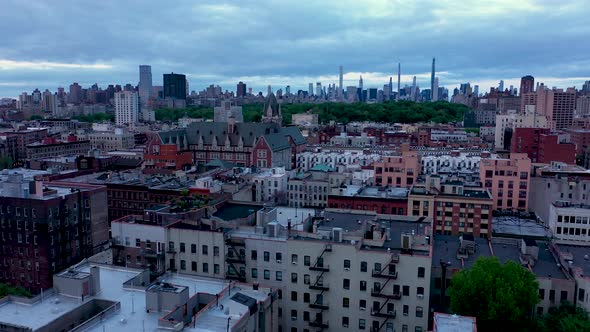 fast aerial flight across the rooftops of the Harlem neighborhood over ...