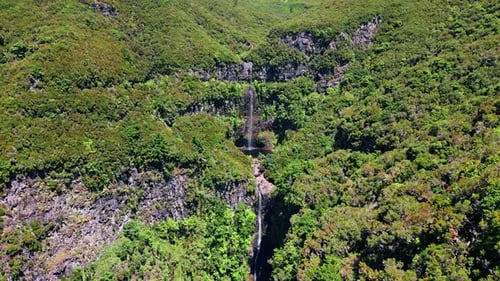 Aerial view of stunning waterfall in tropical forest