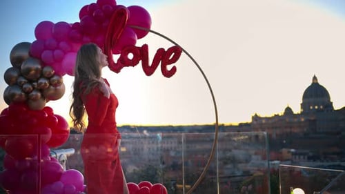 Woman Celebrates Love on Rooftop Overlooking City