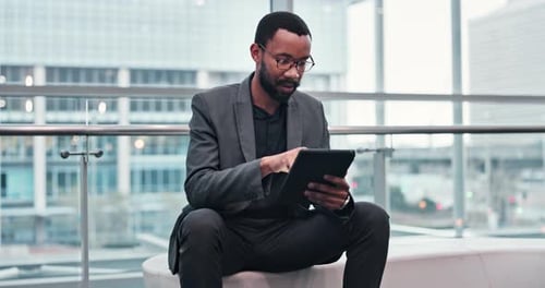 Business, tablet and black man in an office, typing and network with connection