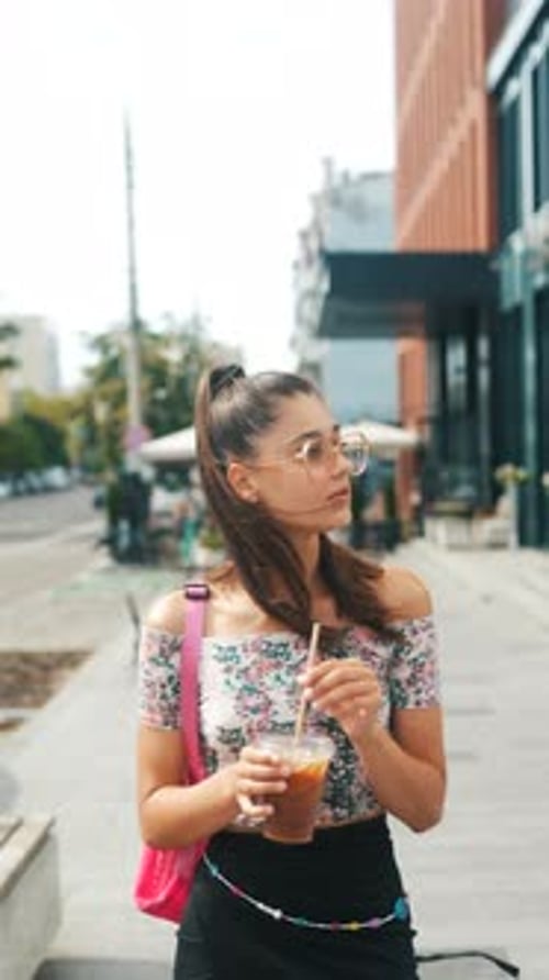 n the Midst of Peak Hours a Lively Young Woman Rushes Through the City Streets