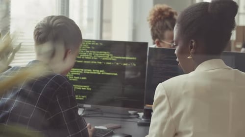 Diverse Team of Software Developers Coding in Office