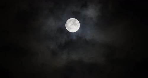 Mystical Full Moon in Dark, Cloudy Night Sky