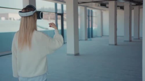 Close Up Woman Using Making Gestures Swipe When Wearing Virtual Reality Empty Building Looks How the