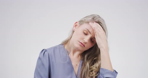 Woman Massaging Temples Suffering From Headache
