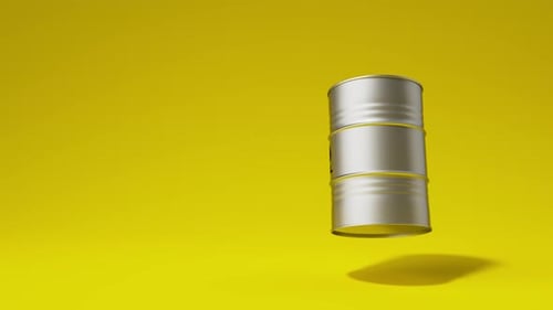 Single Silver Metal Oil Barrel Rotating on Yellow Background Front View Oil Industry Concept 3d