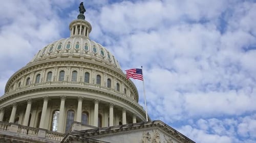 US Capitol Building Dome and Flag Waving