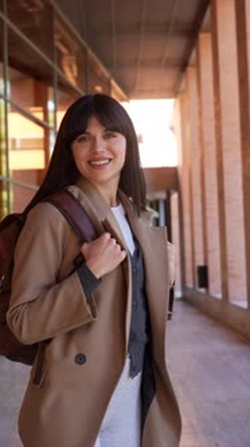 Young female university student smiling at the camera