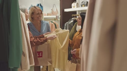 Girlfriends Shopping Together in Designer Showroom