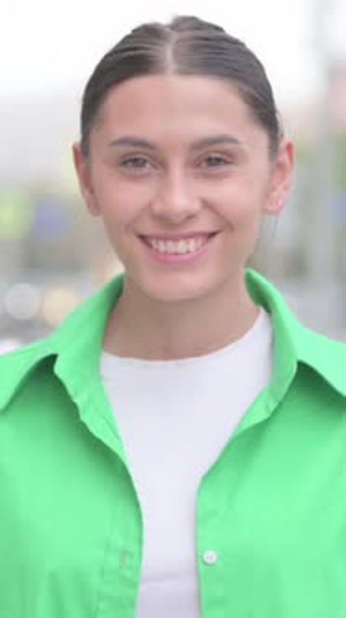 Portrait of Hispanic Woman Smiling at Camera Outdoor, vertical video