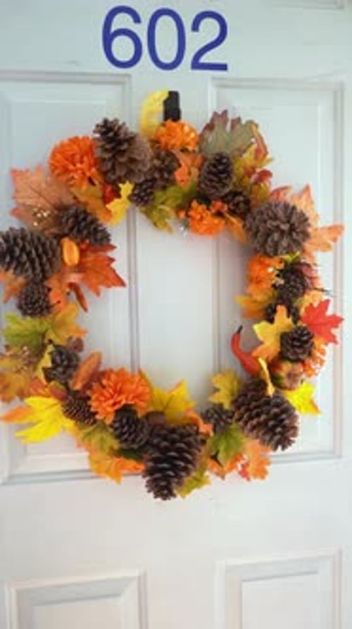 Festive Fall Wreath Hanging on White Door