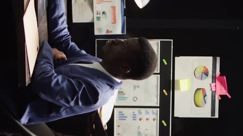 Vertical Video Law Officers Analyze Evidence in Office