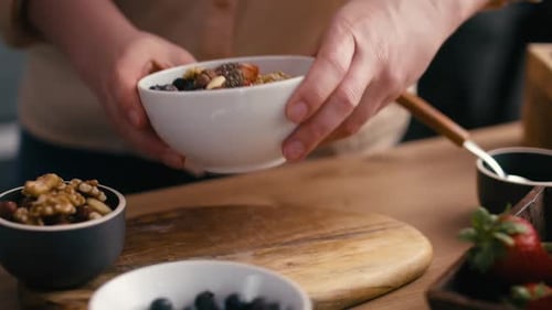 Woman Prepares Healthy Breakfast Bowl at Home