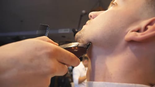 Man Getting Beard Trimmed at Barbershop Close Up