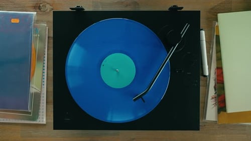 Blue Vinyl Record Spinning on Turntable Overhead