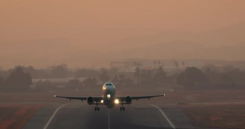 Airplane Taking off During Sunset or Sunrise