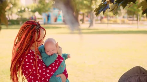 Mother and Baby in the Park The Concept of a Happy Family