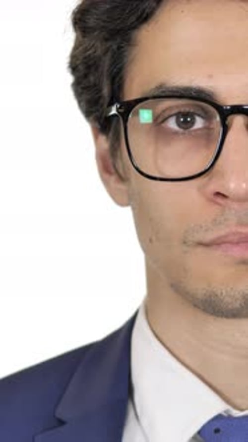 Close up of Serious Young Businessman, White Background, Vertical Video