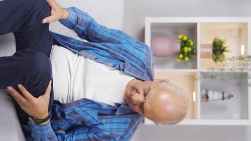 Vertical video of Old man feeling incompetent. The old man sees himself as useless.
