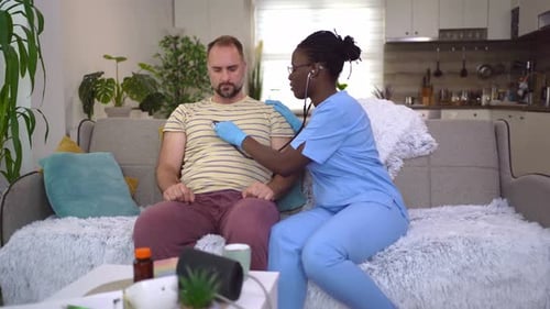Health check at home: Caring moments between patient and nurse