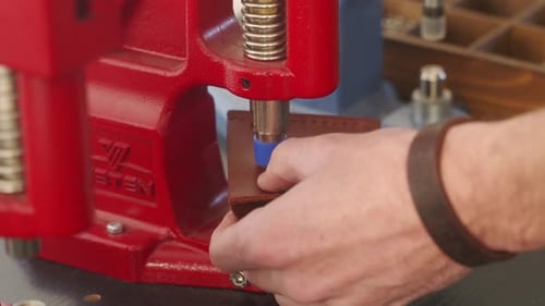 Leather Craftsman Works in Workshop Master Making Leather Wallet Man Installs Tack Button Snap