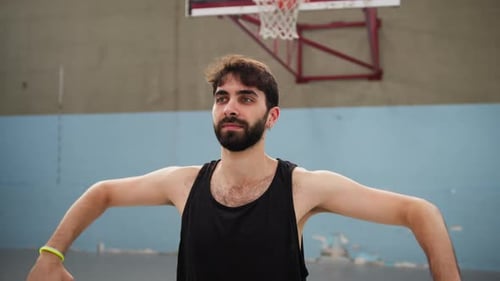 Young Adult Exercising on Basketball Court