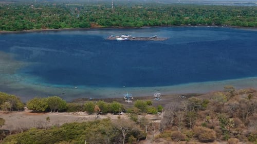 Coastal Landscape in Bali with Blue Ocean and Scenic Mountains in Pemuteran Aerial View