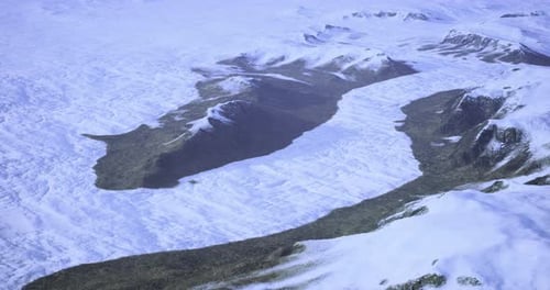Mountain Landscape Showcasing Snow Covered Peaks and Valleys in Cold Climate