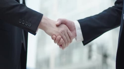 Business Handshake Agreement Partnership Collaboration in Suits