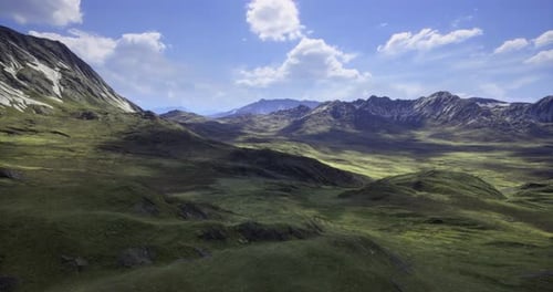 Majestic Mountain Landscape with Rolling Hills and a Bright Blue Sky
