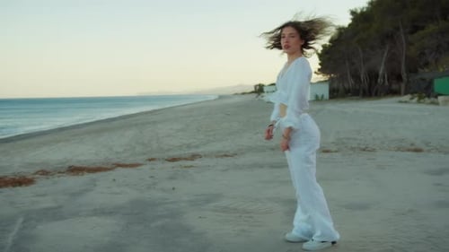 White Dressed Hip Hop Dancer Girl On The Beach Near The Sea In Summer At Sunset