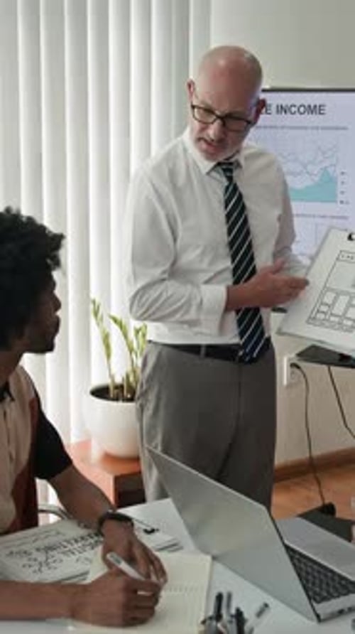 Business Meeting with Presentation in Modern Office