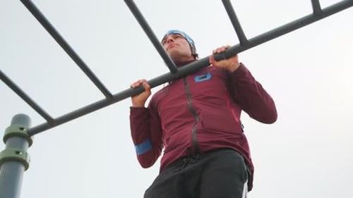 Park Pullup Effort Someone Doing Pullups At Park Under Cloudy Skies Individual Exercises On Outdoor