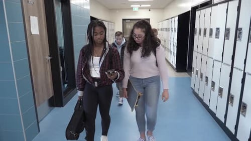 Of Students in School Corridor with Phone