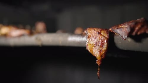 Sauna Estonia Traditionally Smoked Meat, BBQ Cooking Juicy Fresh Grilled Meat on Wooden Grid inside